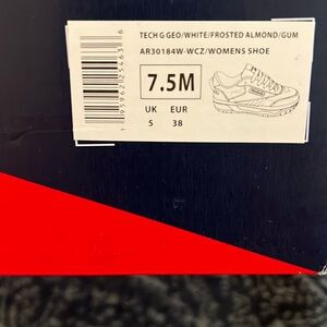 Basic white tennis shoe.